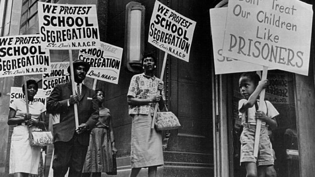 Protestors in 1964 picket continued segregation
