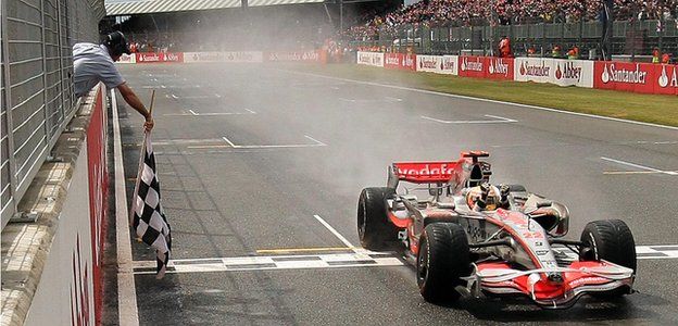 Lewis Hamilton crosses the finish line to win the 2008 British Grand Prix