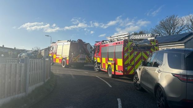 Anglesey: Small plane crashes into back garden of house - BBC News