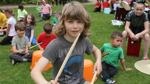 Merrick Surman and local children drumming at the National Trust's Quarry Bank Mill