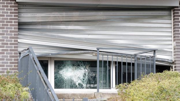 The window of a local police station smashed overnight by protesters in Aulnay-sous-Bois on 6 February 2017