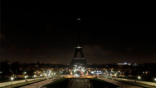 The Eiffel Tower goes dark in memory of the victims of the attack on Christmas shoppers at a market in Strasbourg, France, 13 December 2018