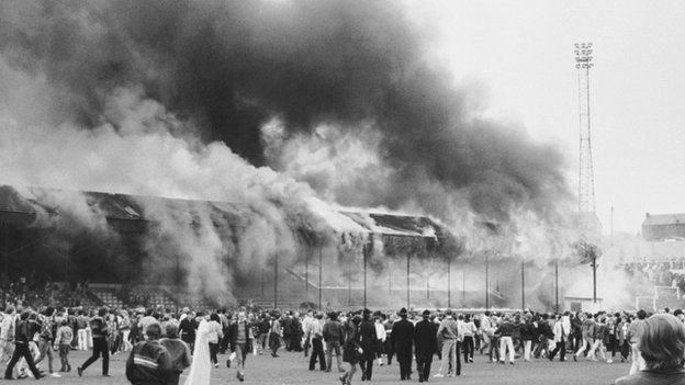 Fire at Valley Parade and fans on the pitch