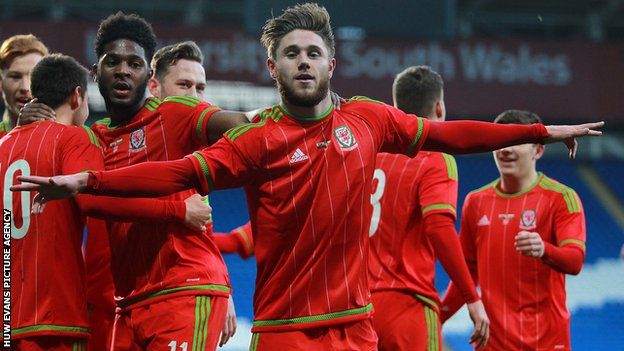 Wes Burns celebrates a goal for Wales Under-21s