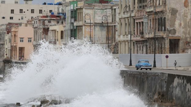 Waves splash at the seafront Malecon during the passage of the Tropical Storm Laura in Havana, Cuba