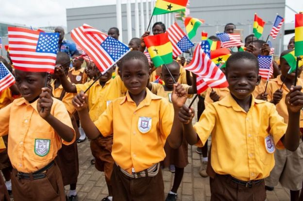 Children wave the American and Ghana flags for US First Lady Melania Trump during an arrival ceremony after landing at Kotoka International Airport in Accra October 2, 2018 as she begins her week long trip to Africa to promote her 'Be Best' campaign.