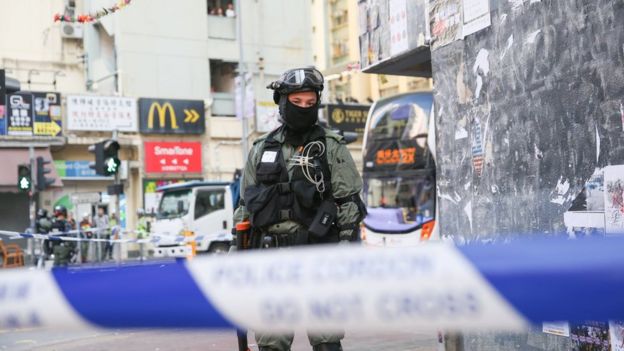 Police guard the scene where the protester was shot