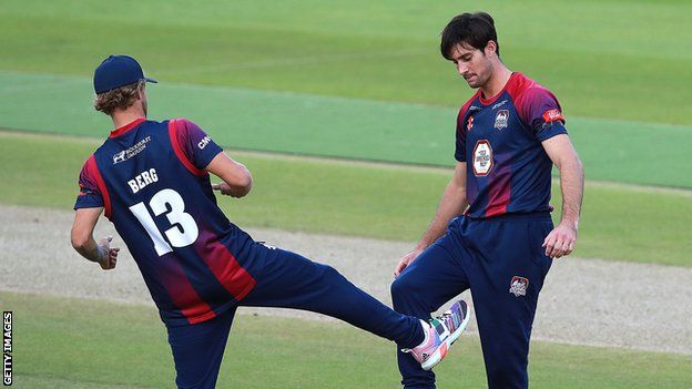 Northants' Brandon Glover (right) celebrates with team mate Gareth Berg after taking the wicket of Dan Douthwaite