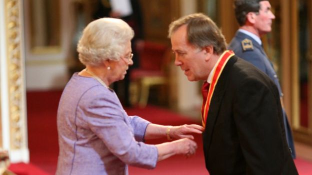 George Castledine receiving his knighthood from the Queen