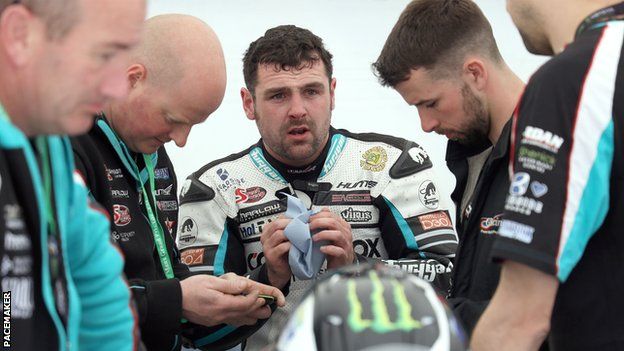 Michael Dunlop and his MD Racing crew in the garage