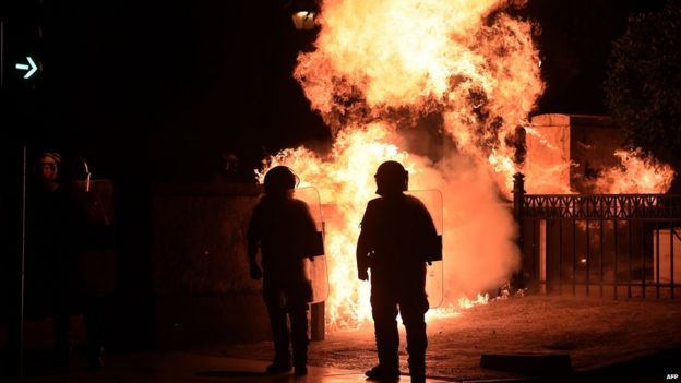 Fire bomb explodes near riot police in Athens on 22 July 2015