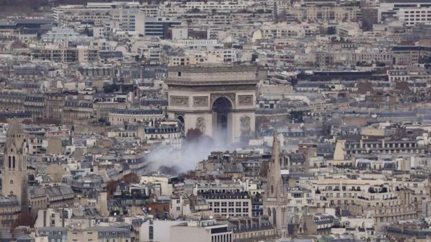 Aerial view showing smoke rising near the Arc de Triomphe