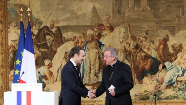Luigi Ventura shaking hands with Emmanuel Macron