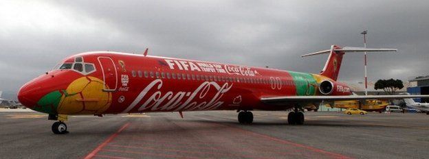 A jet emblazoned with Coca-Cola and Fifa logos