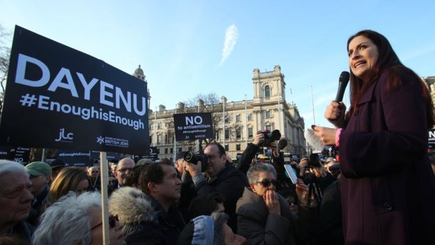 Luciana Berger talking to protesters in London
