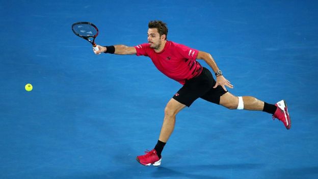 Stan Wawrinka of Switzerland plays a forehand in his semifinal match against Roger Federer of Switzerland on day 11 of the 2017 Australian Open at Melbourne Park on January 26, 2017 in Melbourne, Australia.