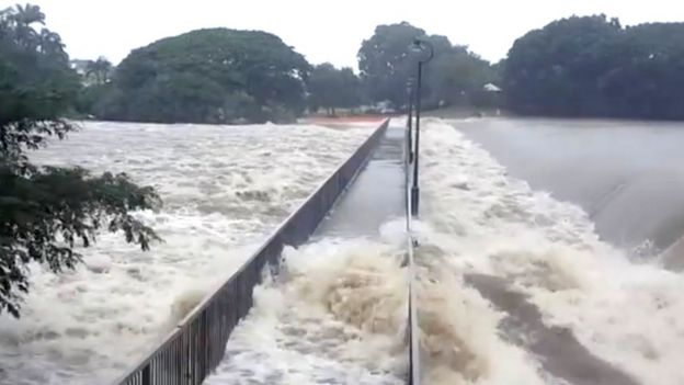 Floodwater flows over the Aplins Weir Rotary Park footbridge in Townsville, Queensland, Australia, 3 Feburary 2019