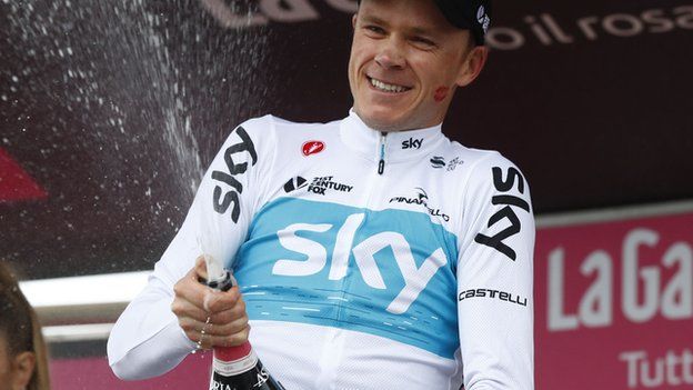 Chris Froome sprays the celebratory champagne after winning stage 14