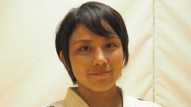 Yuko Fujii posing for a photo during a break in coaching