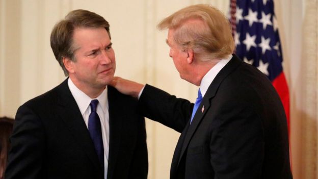 US President Donald Trump speaks with Supreme Court nominee Judge Brett Kavanaugh in the East Room of the White House