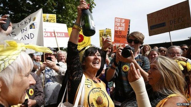 Anti-fracking protesters celebrate outside County Hall in Preston