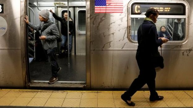Passengers wait inside a subway train in New York City (21 April 2017)