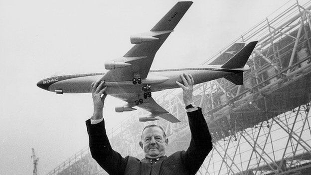 Keith Granville, managing director of BOAC, holds up a model of the new Boeing 747 in 1969