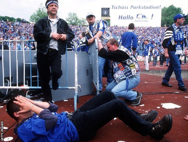 Schalke fans are disconsolate after realising Bayern have avoided defeat in Hamburg