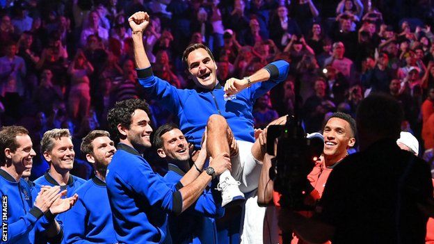 Roger Federer is hoisted aloft by his team-mates at the O2 Arena in London