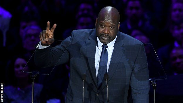 Former Los Angeles Lakers star Shaquille O'Neal raises a peace sign after giving a speech in memory of former team-mate Kobe Bryant