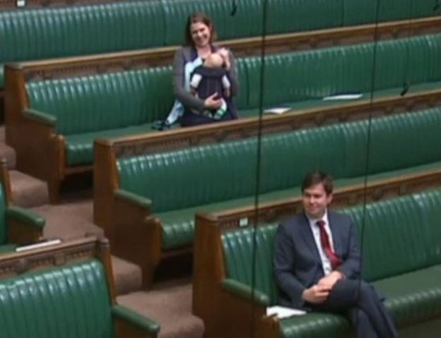 mp cradles baby on