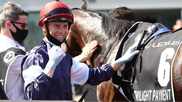 Jockey Jye McNeil after winning the Melbourne Cup on Twilight Payment