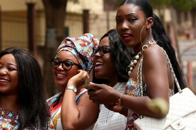 Girls laugh on February 17, 2018 in Yaounde, Cameroon.