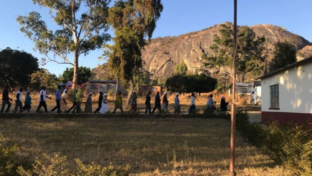 People queuing to vote