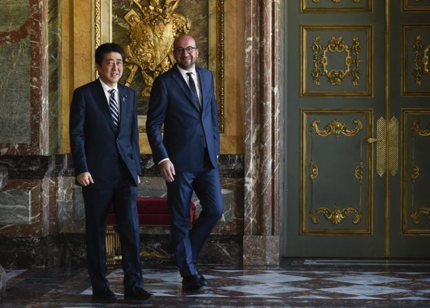 Belgian Prime minister Charles Michel (R) arrives with Japan's Prime Minister Shinzo Abe (L) before their meeting in Brussels, Belgium, 5 July 2017