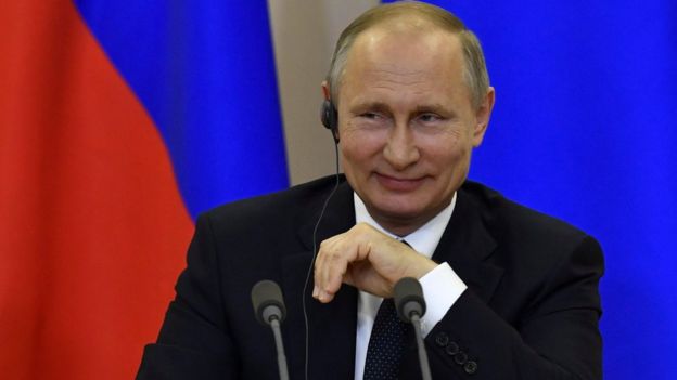 Russian President Putin smiles during joint press conference with Italian PM Gentiloni following their meeting at Bocharov Ruchei state residence in Sochi