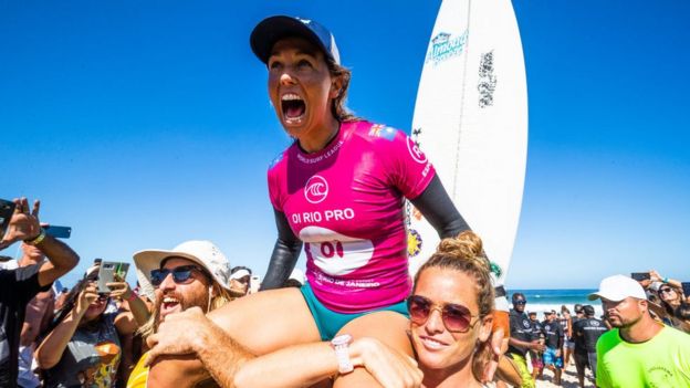 Sally Fitzgibbons sits on top of her supporters shoulders as she celebrates her Rio Pro win