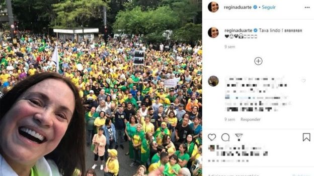 Postagem no Instagram em que Regina Duarte aparece sorrindo em manifestação, repleta das cores verde e amarelo