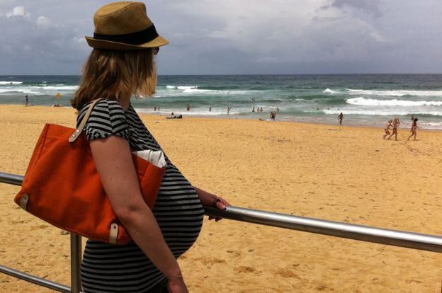 Jen, pregnant on the beach in Australia