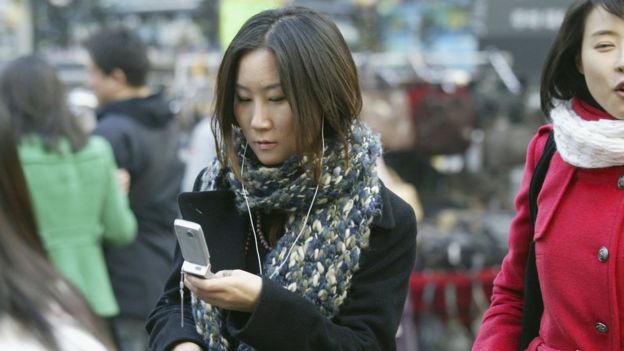 Young person on mobile phone in South Korea