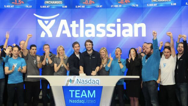 Atlassian co-founders Mike Cannon-Brookes and Scott Farquhar ring the bell at the Nasdaq
