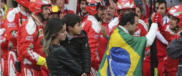 Massa is greeted by the Ferrari team