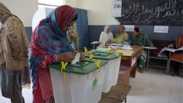 A woman casts her vote during Pakistan"s general election