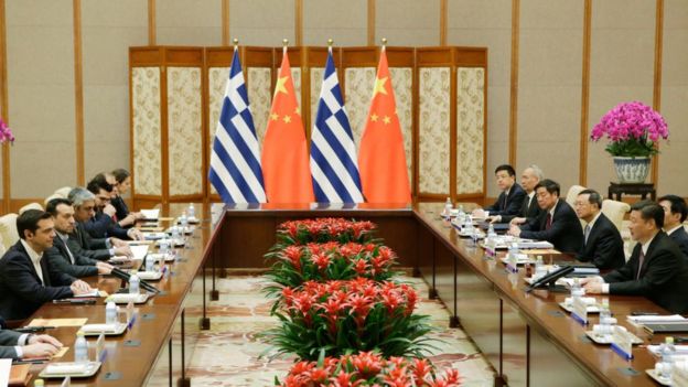 Greece's Prime Minister Alexis Tsipras (L) talks with China's President Xi Jinping (R), ahead of the Belt and Road Forum, in Beijing on May 13, 2017