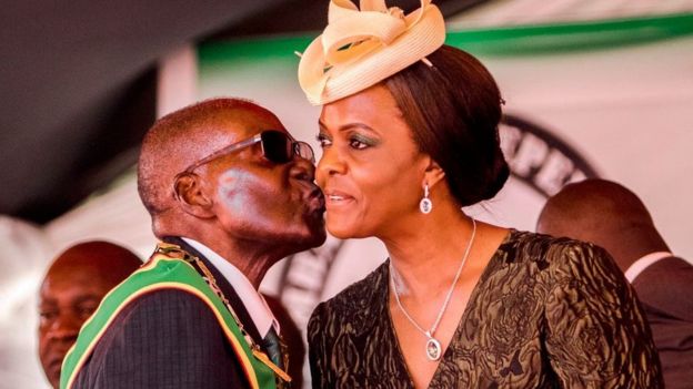 President Robert Mugabe kisses his wife and first lady Grace Mugabe during during the country's 37th Independence Day celebrations at the National Sports Stadium in Harare April 18, 2017