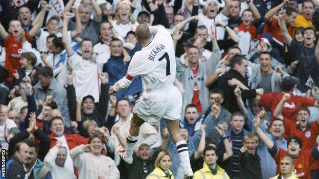David Beckham celebrates in front of fans, 2001.