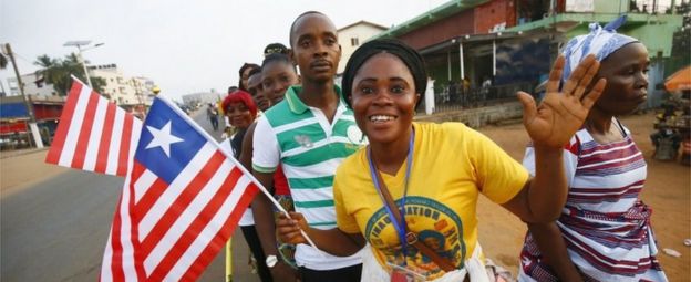 Liberians cheer as they stand in line to enter the inauguration off the President-elect, George Weah, at the Samuel Kanyon Doe stadium, in Monrovia, Liberia, 22 January 2018.