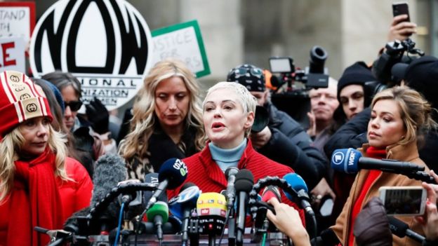Actress Rose McGowan (2-R) talks to journalists during a press conference with other women who have all accused former Hollywood producer Harvey Weinstein