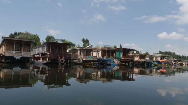 Empty houseboats on Srinagar's Dal lake.
