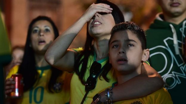 Fans can't look during Brazil's loss to Germany at the 2014 World Cup
